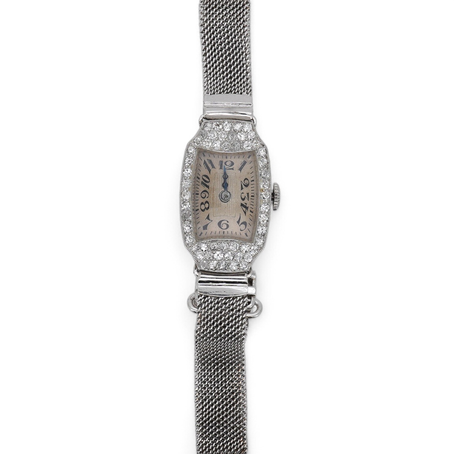 A lady's mid 20th century Swiss white metal(platinum mark) and diamond set cocktail watch with 'tumbling' Arabic numeral dial, on a 9ct white metal mesh link bracelet, case diameter 16mm, overall length 16cm, gross weigh